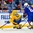 BUFFALO, NEW YORK - JANUARY 4: Sweden's Lias Andersson #24 skates away from USA's Quinn Hughes #6 with the puck during the semi-final round of the 2018 IIHF World Junior Championship. (Photo by Andrea Cardin/HHOF-IIHF Images)

